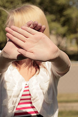 Teen Blocking Face