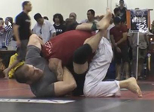 Alex Embry, left, performing a choke (martial arts technique)